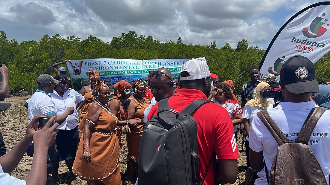 Community elders in traditional dress joining a CYA tree-planting day